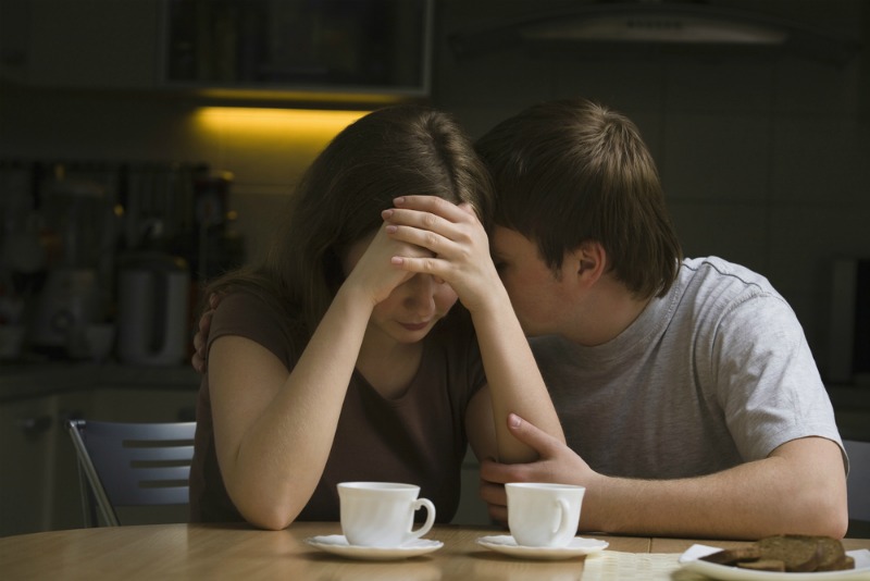 Image of man consoling partner