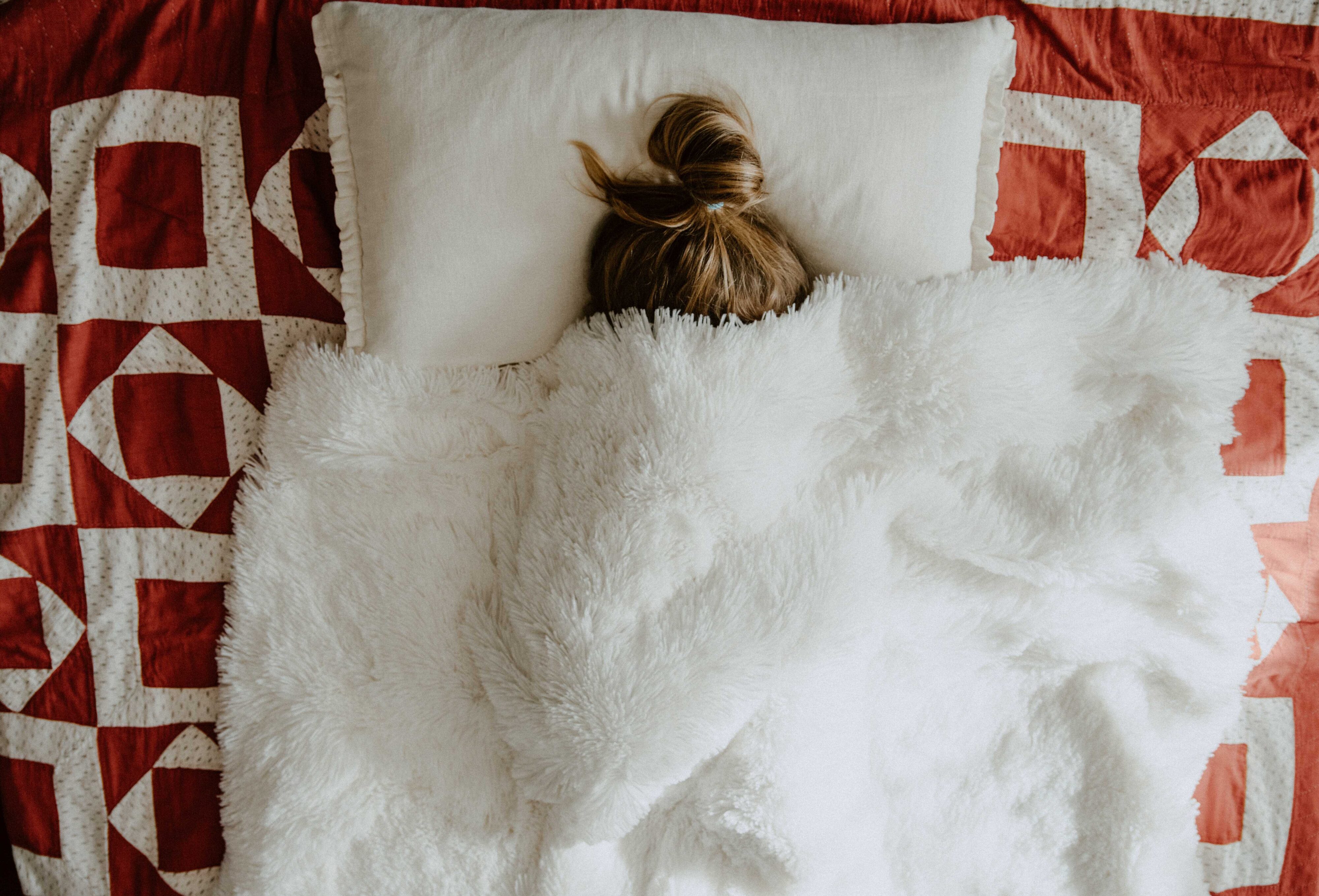 girl under blanket